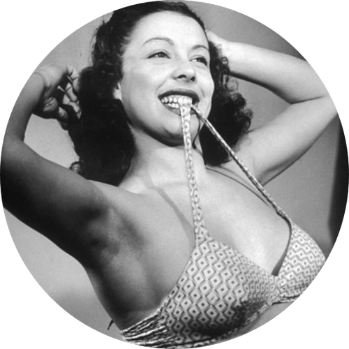 Pin-up girl holding up her bra with her teeth