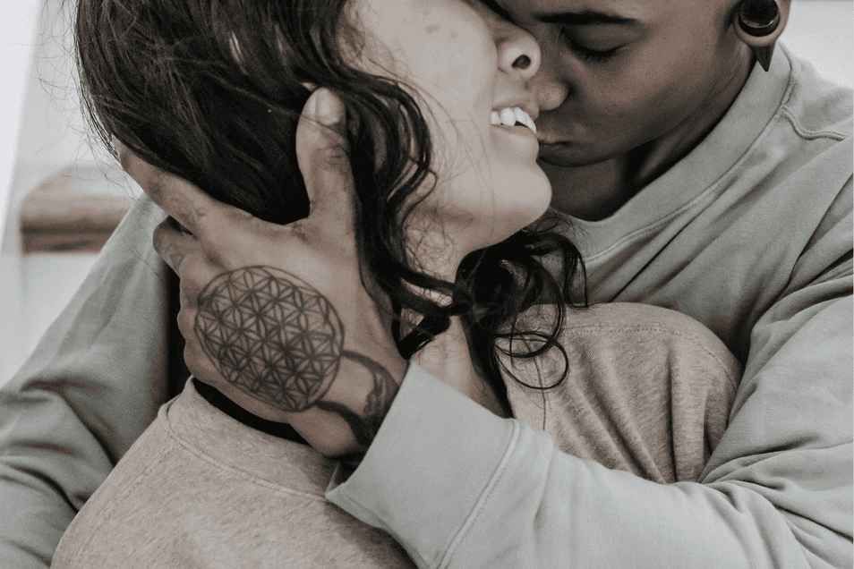 Couple exploring intimacy and sex from behind